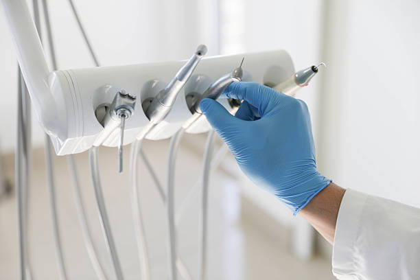 Professional Tooth Extraction technician working in Halls, TN